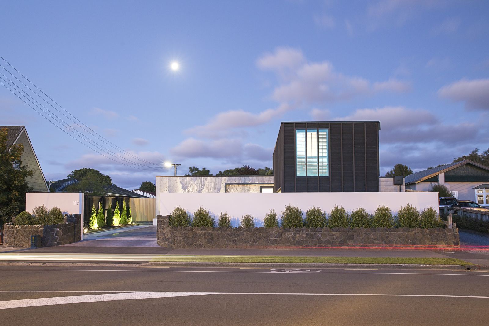 Barrington St House – timber-clad Christchurch home with dramatic street frontage by AW Architects