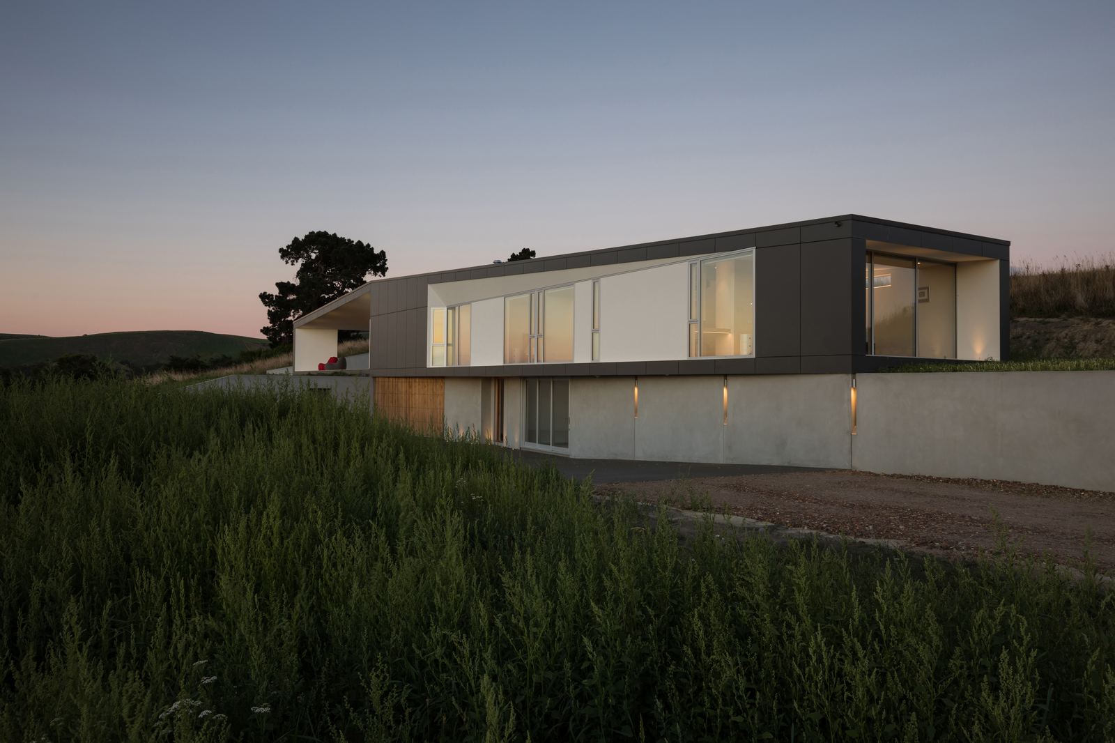 Tai Tapu House – sculptural Port Hills home with black cladding by AW Architects