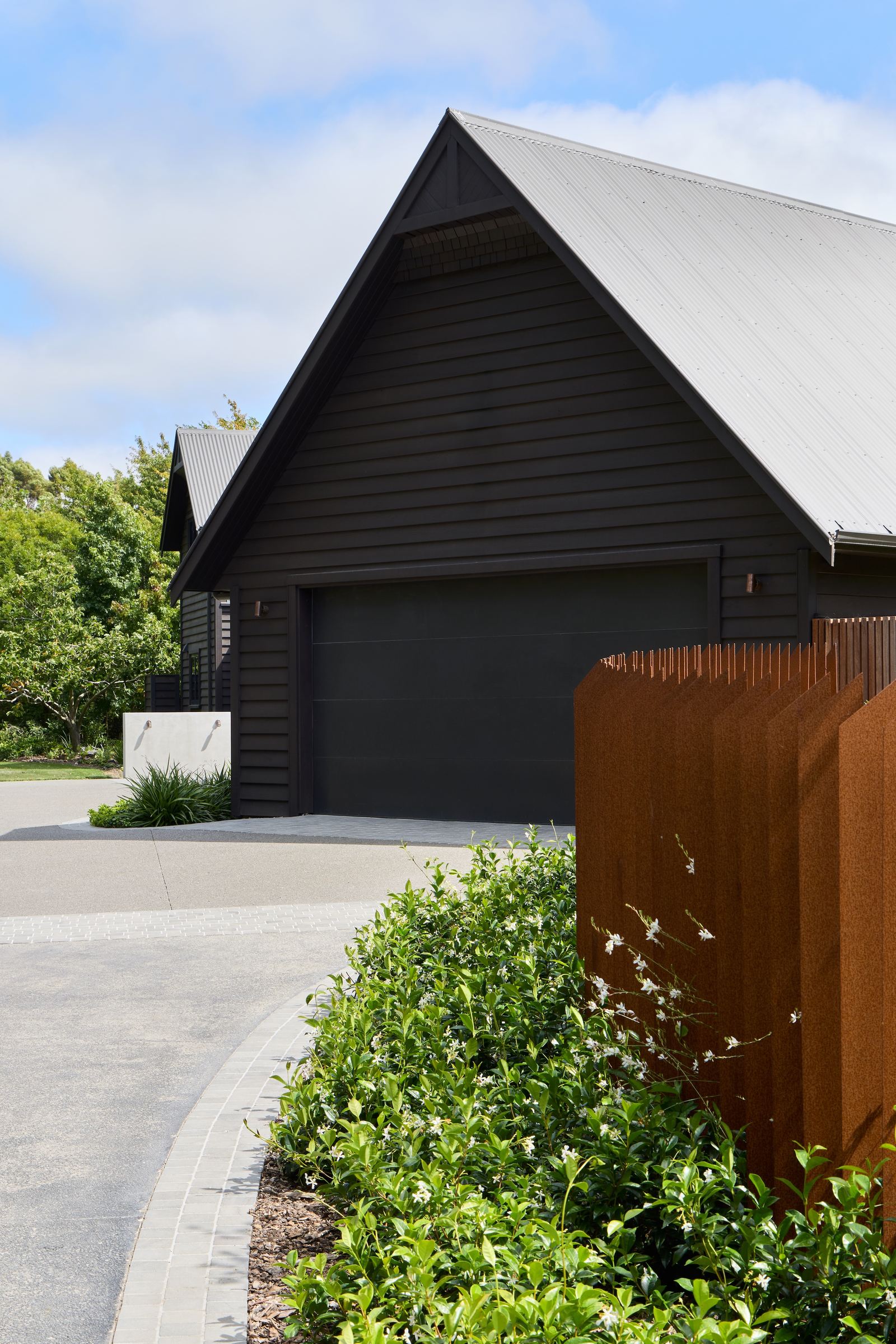 Tai Tapu lakeside home alteration with oak, cedar and clay plaster interiors by AW Architects – image 4