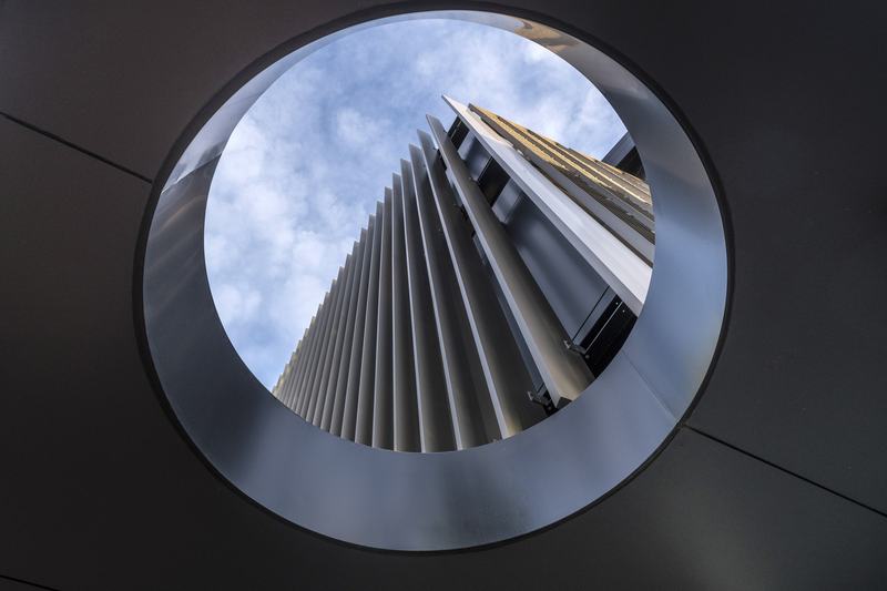112 Cashel – Cashel Mall mixed-use building with bronze fins by AW Architects – image 6