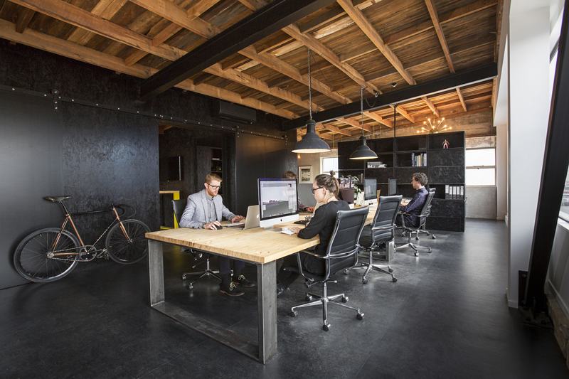 St Asaph Studio – Christchurch shared studio with exposed rimu and bold colour by AW Architects