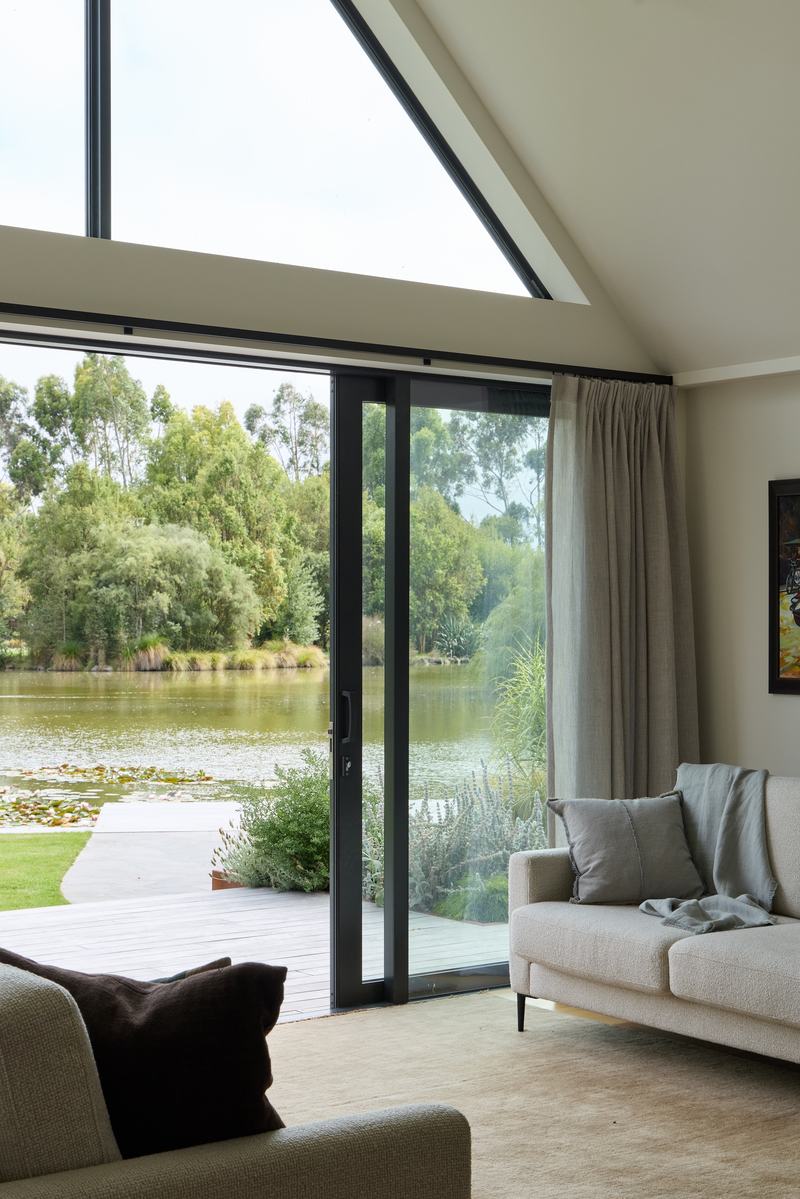 Tai Tapu lakeside home alteration with oak, cedar and clay plaster interiors by AW Architects – image 5